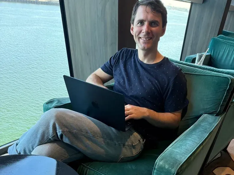 Tom writing his book on ADHD overlooking the water